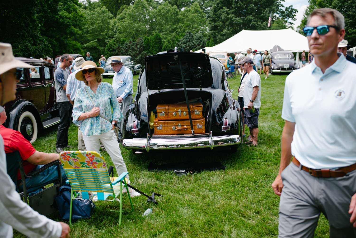 Elegance packed and ready to go — vintage style, leather trunks, and timeless curves on display