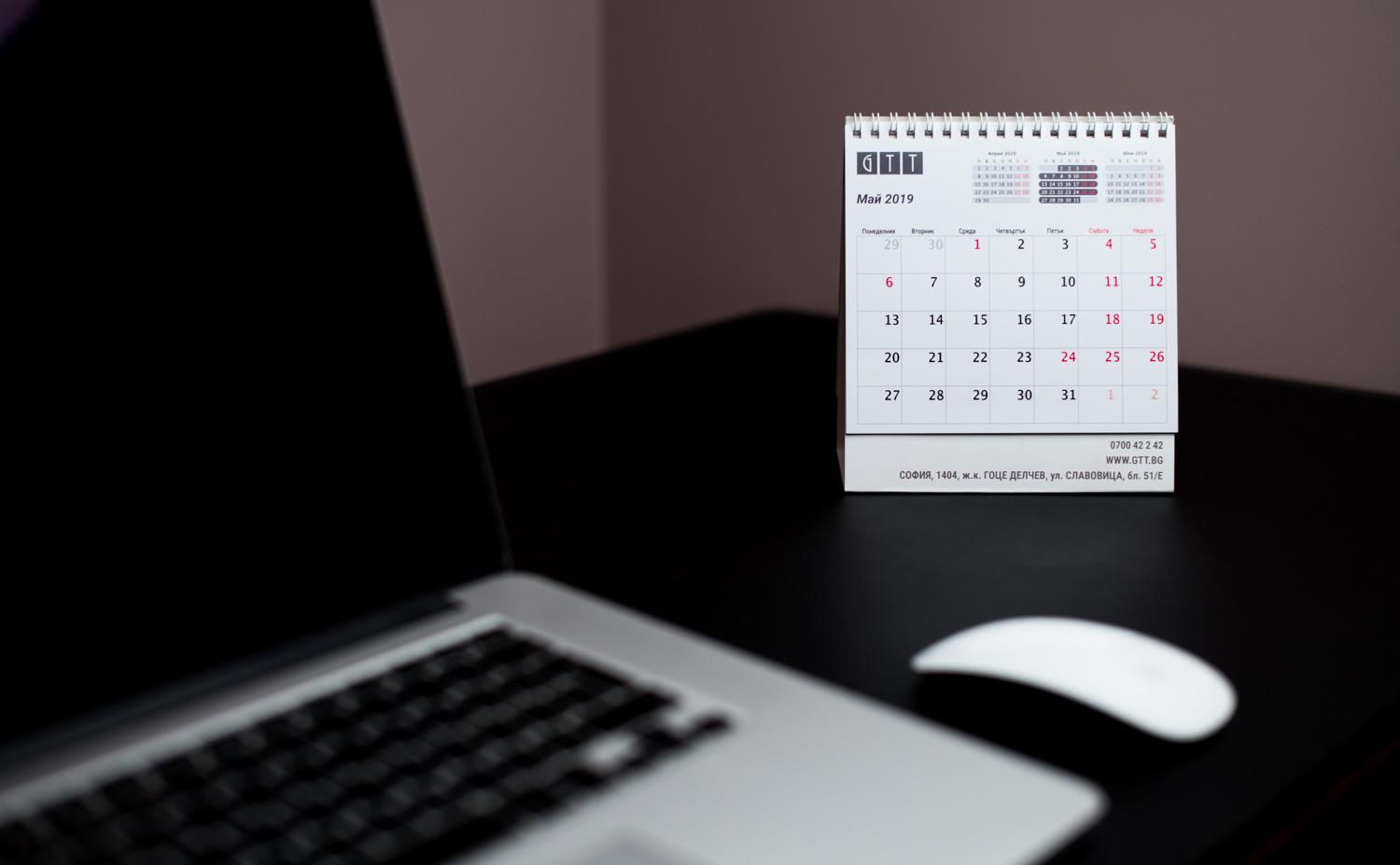 Pyramid type desk calendar with 3 mini calendars on top, and a picture on the back.