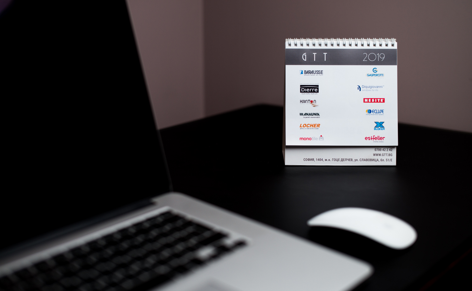 Pyramid type desk calendar with 3 mini calendars on top, and a picture on the back.
