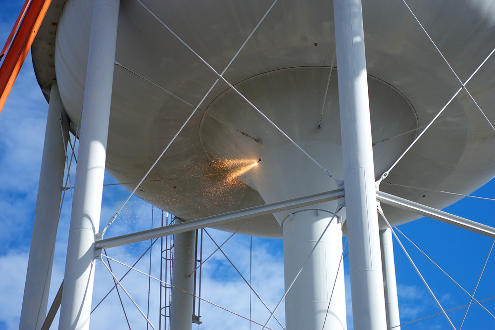 oxy-fuel cutting water tower demolition - Freeland Construction
